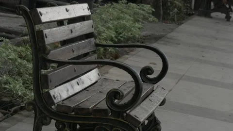 Closeup view, empty bench made of wood and steel with armrest Stock Footage 137420290