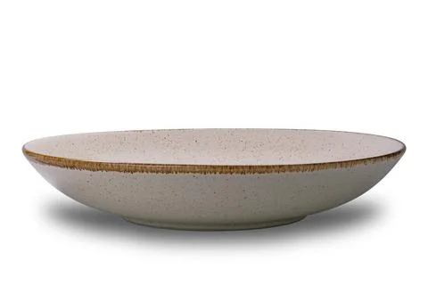 Closeup view of empty spotted brown ceramic bowl with dark edge. Stock Photos