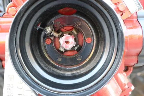 A closeup view of an engine component featuring striking red detailing for Stock Photos