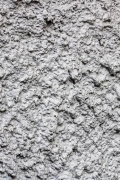 This is a closeup view featuring the intricate texture of a concrete wall Stock Photos