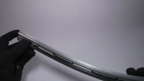 Closeup view of a Flexible Automotive Windshield Wiper Blade component Stock Footage 303816470