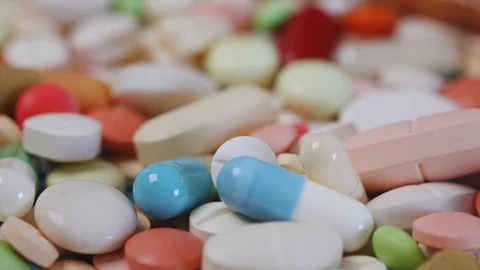 Closeup view focusing in and out of stack of pills Video stock 95912877