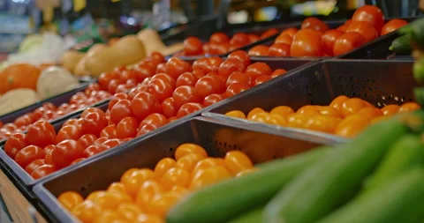 Closeup view of fresh ripe vegetables in supermarket, red tomatoes and green Stock-Footage 232970338