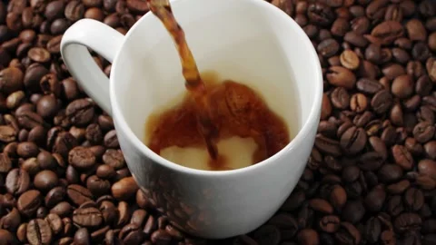 Closeup view of freshly brewed fragrant black coffee being poured into white cup Stock Footage 146921783