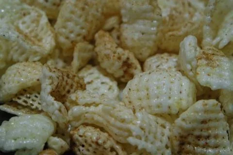 Closeup view of freshly fried chips as fast food usually eaten with tea. Stock Photos