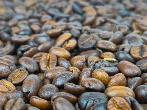 A CloseUp View of Freshly Roasted Coffee Beans Showcasing Their Rich and Ar.. Foto stock
