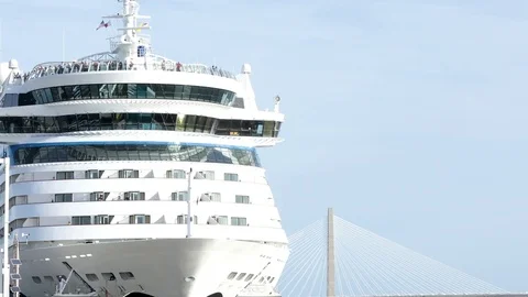 Closeup view of front of cruise ship with passengers milling about on decks Stock Footage 71131253