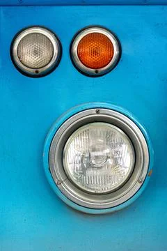 Closeup view of the front lights of an old historic Mercedes bus situated i.. Stock Photos