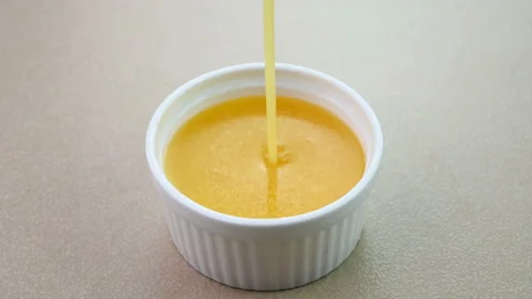 Closeup view of ghee in a bowl Stockbeeldmateriaal 227868146