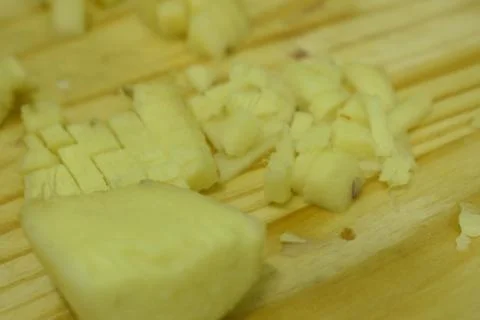 Closeup view of ginger in cutting board background. Stock Photos