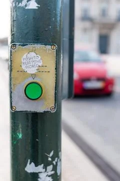 Closeup view of a green button with a quote Push to reset the world Stock Photos
