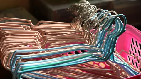 Closeup View of Group of Clothes Hangers in Box Stock Footage 304153302
