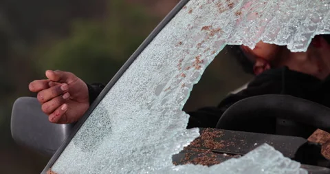 A closeup view of a hand injured inside a damaged accident car Stock Footage 335556387