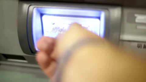 Closeup view hand inserting credit card into an ATM machine. cash machine w.. Stock Footage 272756915