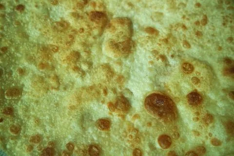 Closeup view of hand made plain bread in oil called paratha roti. Stock Photos