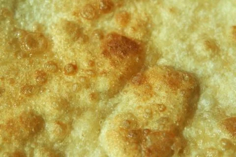 Closeup view of hand made plain bread in oil called paratha roti. Stock Photos