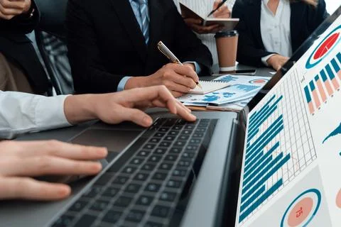 Closeup to view hand using laptop to analyze financial data in harmony office. Stock Photos