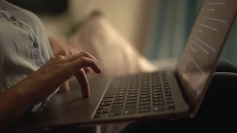 A CloseUp View of Hands Actively Typing on a Laptop While Working from Home in a Video stock 289965474