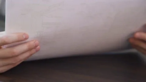 Closeup view on hands of architect with blueprints inside office Stock Footage 75613170