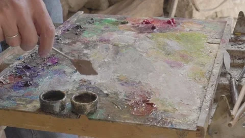 Closeup view of hands which are painting in a new way. Stock Footage 132961760