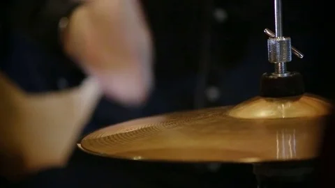A closeup view of a hi hat cymbal played with a drumstick Stockbeeldmateriaal 72189689