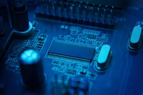 Closeup view of a highly advanced futuristic circuit board illuminated with Stock Photos