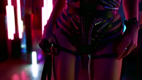 Closeup view of hips of slender stripper in nightclub, leather lingerie of young Stock Footage 144042069