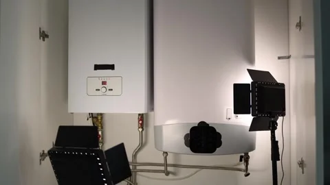Closeup view of home heating system with modern boiler and water heater illumina Stock Footage 318867841