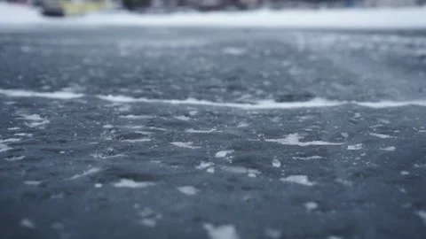 Closeup view on ice and snow road surface. Footage. Focus is on the road's Stock-Footage 141461635