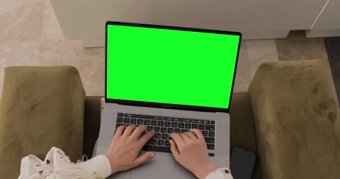 Closeup view of laptop with green screen. Woman sitting in lobby, Texting email  Stock Footage 154335967