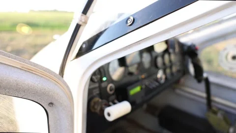 Closeup view of light aircraft cockpit with control instruments and open door Video stock 313482349