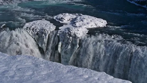 Closeup-view of lower cascade of Gullfoss waterfall, Iceland in winter with ice Stock Footage 154160854