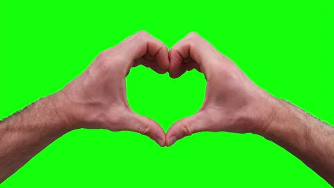 Closeup view of male hand making heart shape gesture isolated on green screen. Stock Footage 134973607
