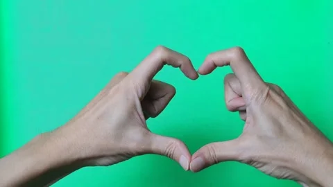 Closeup view of male hand making heart shape gesture isolated Stock Footage 279295311