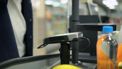 Closeup view of man customer paying for purchases with credit card at checkout Stock Footage 169498904