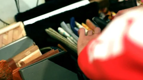 Closeup view of man hands choosing handmade pocket in traveling art shop 스톡 동영상 116267775