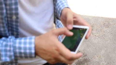 Closeup view of man with marriage ring hands holding and using digital smart Stockbeeldmateriaal 91887366