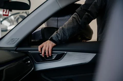 Closeup view of man opening car door Stock Photos