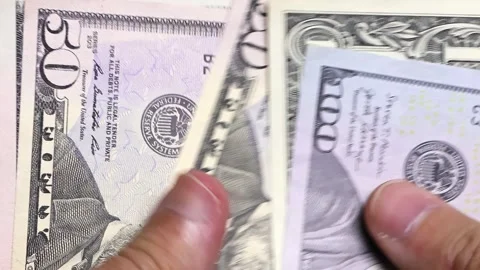 Closeup view of man's hands and wallet with american dollar banknotes (USD). Stock Footage 302238502