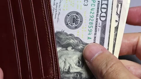 Closeup view of man's hands and wallet with american dollar banknotes (USD). Stock Footage 302238717