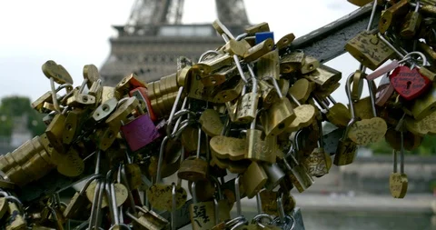 Closeup view of many padlocks with names of lovers on bridge in Paris, Eiffel 動画素材 113979492