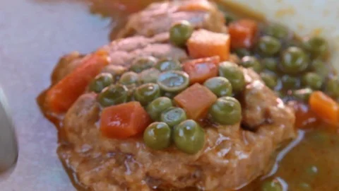 Closeup View Of A Meal - Meat, Peas And Carrot Stock Footage 99063904