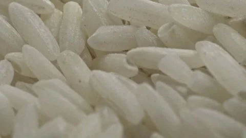Closeup View of Medium Grain White Raw Rice Grains Showing Natural Shape and 库存影片 348801600