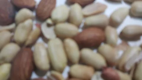 Closeup view of mixed dried and roasted  peanuts and almonds. A fruit for bac Stock Photos