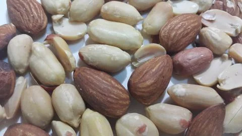 Closeup view of mixed dried and roasted  peanuts and almonds. A fruit for bac Stock Photos