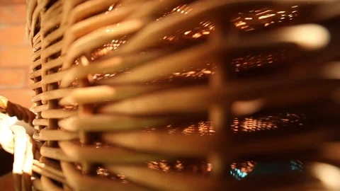 Closeup view of modern brown wicker basket with summer sunlight on background 스톡 동영상 98230006