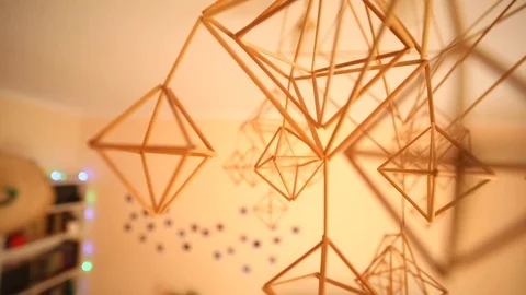 Closeup view of modern interior geometry decoration details hanging in the air 스톡 동영상 98560945