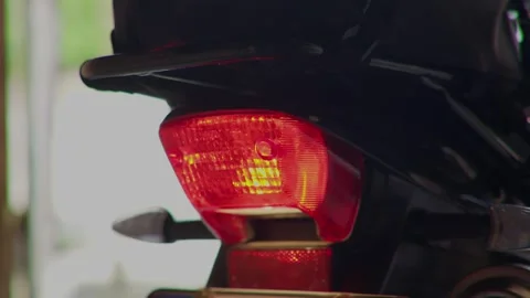Closeup view of a motorcycles tail light and indicators, highlighting their Stock Footage 310169542