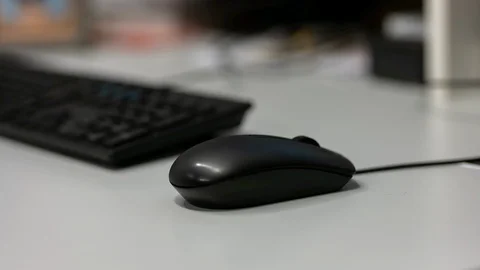 Closeup view from a moving hand with a computer mouse Stock Footage 122053025