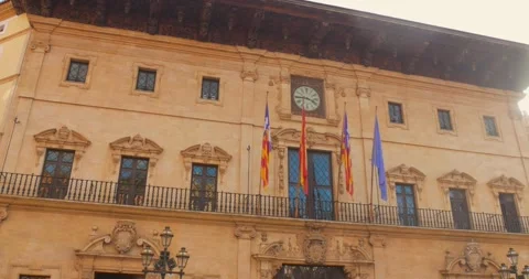 Closeup view of multiple flags waving at balcony of Town hall in Palma de 스톡 동영상 308787741